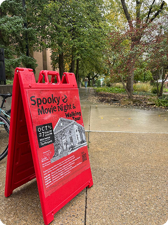 Outdoor A-frame sign promoting the haunted tour